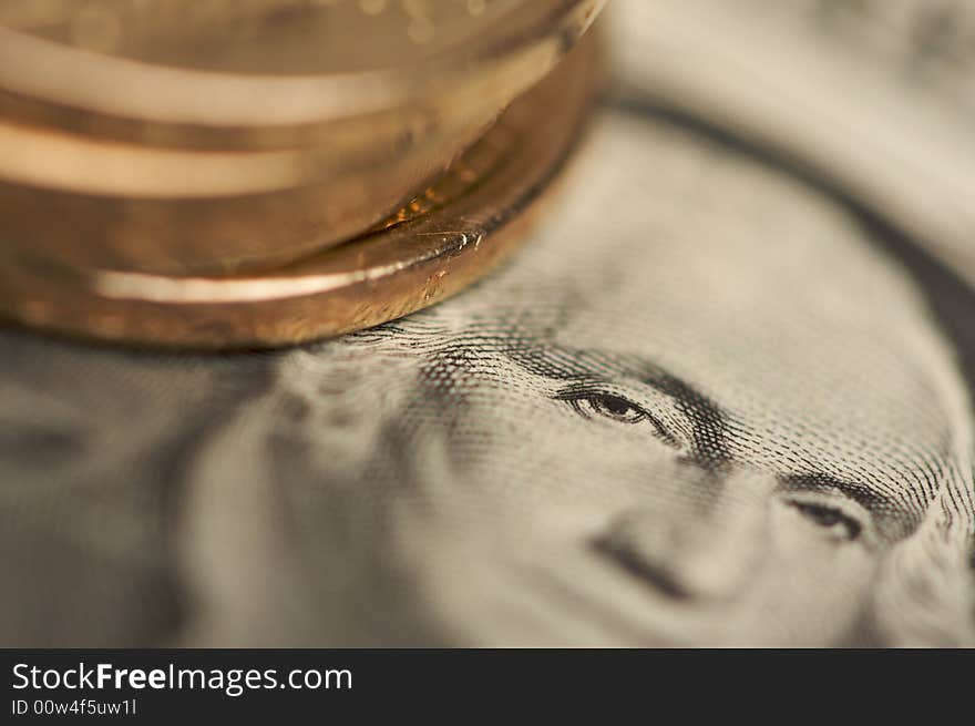 Extreme Close-up Abstract of the new U.S. Dollar coin on Dollar Bills with Narrow Depth of Field. Extreme Close-up Abstract of the new U.S. Dollar coin on Dollar Bills with Narrow Depth of Field.