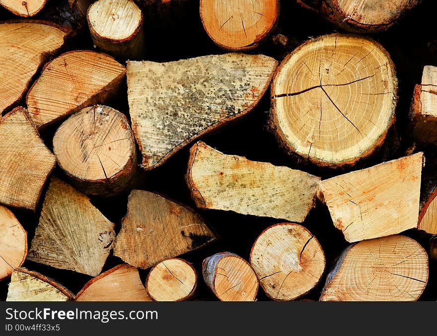 pile of cut wood for the fireplace. pile of cut wood for the fireplace