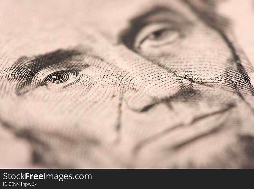 Abstract Macro of U.S. Five Dollar Bill's Abraham Lincoln face with Narrow Depth of Field. Abstract Macro of U.S. Five Dollar Bill's Abraham Lincoln face with Narrow Depth of Field.