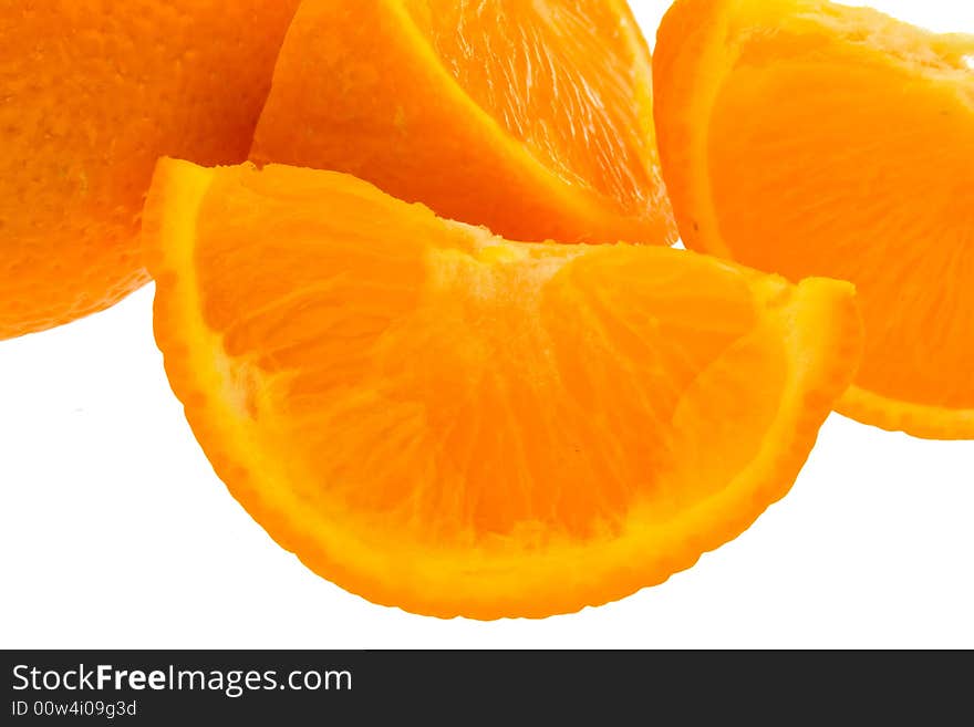 Whole orange plus segments against white background