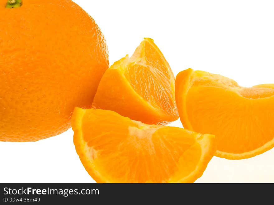 Whole orange plus segments against white background