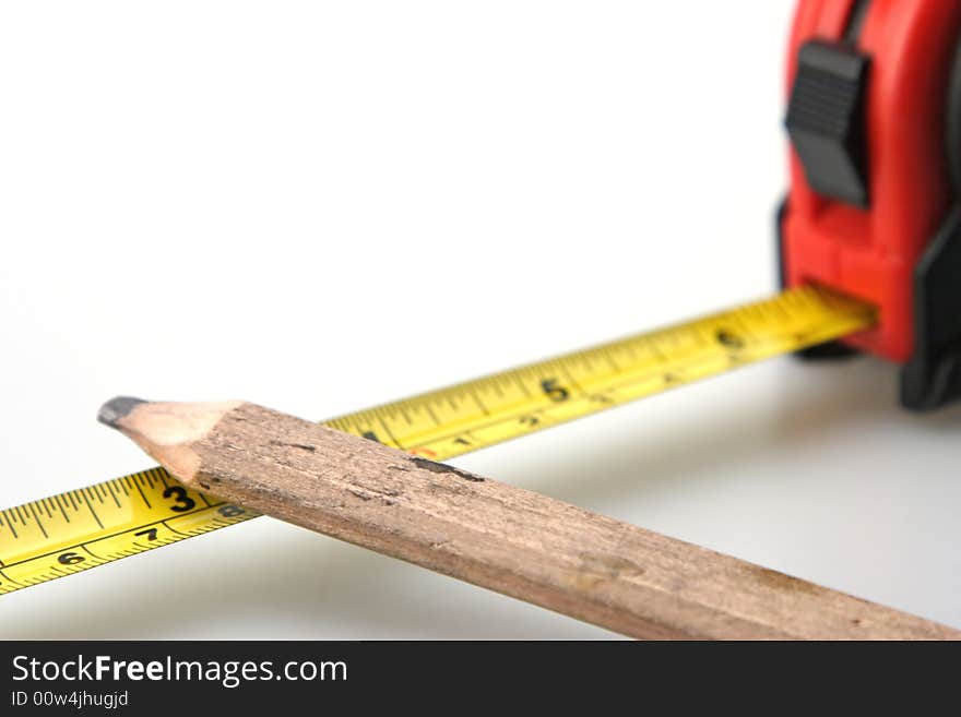 Pencil and Black and Red Tape Measure White Background. Pencil and Black and Red Tape Measure White Background