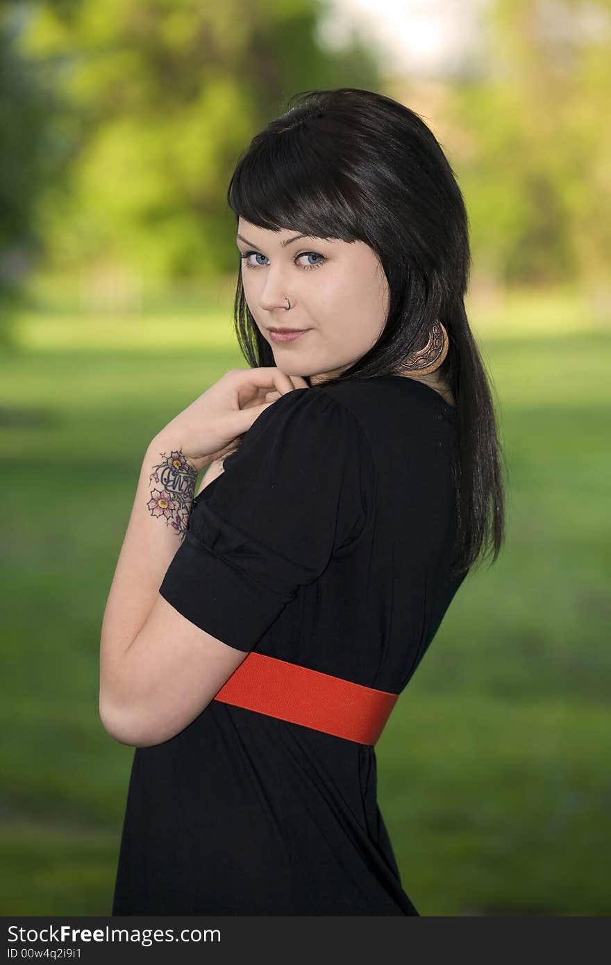 A portrait of a lovely young lady outdoors