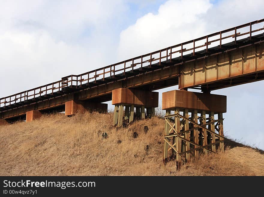 Abstract detail of the rusting ironwork on an old train bridge