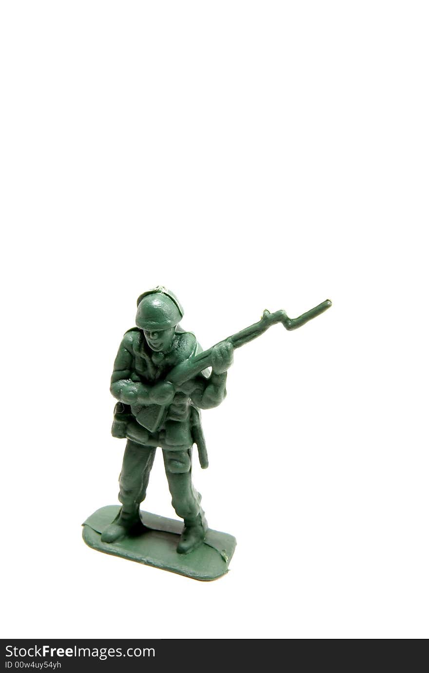 Green army man with rifle and bayonet on a white isolated background.