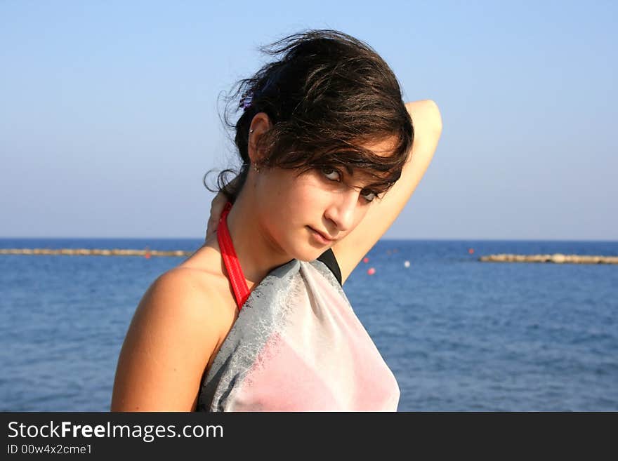 Pretty girl in the pareo on the beach.