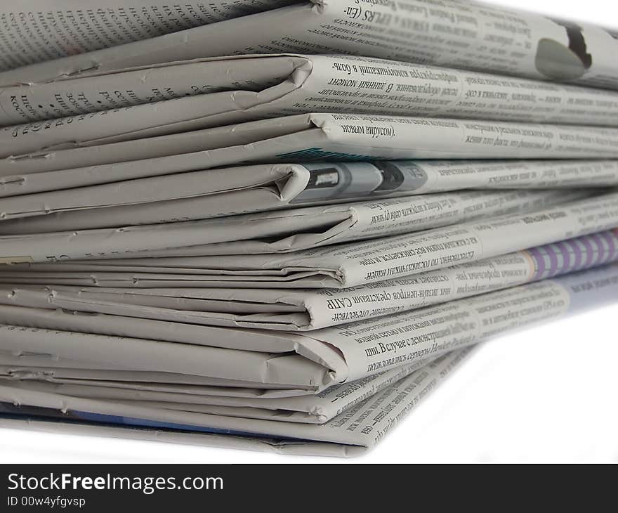 Close up colored newspapers lists isolated on white