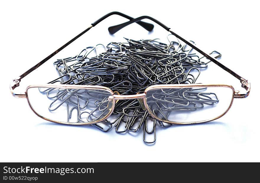 Clips and glasses on a piece of paper. Business scene