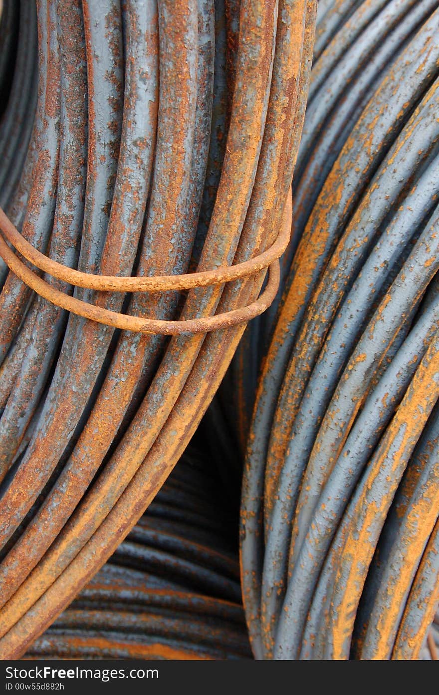 Large rusty steel coils in a factory. Large rusty steel coils in a factory