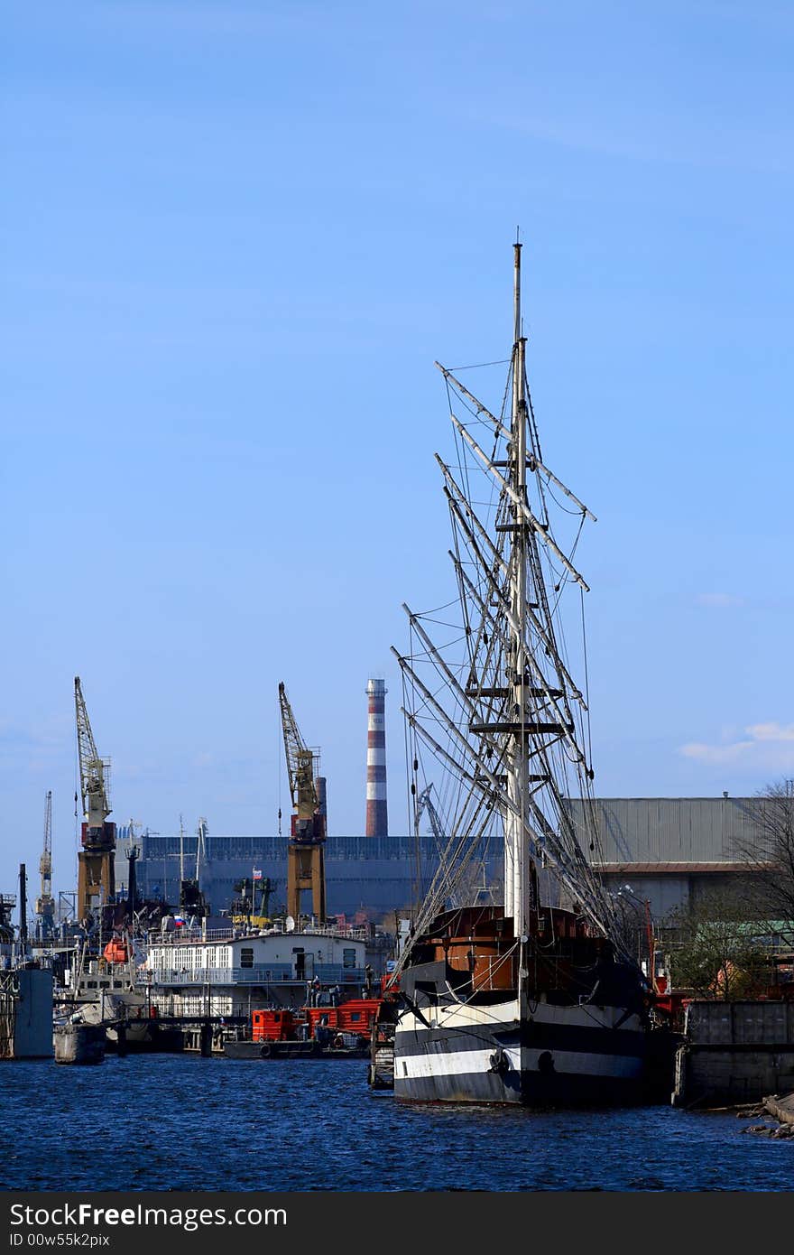 Sailing Ship At The Port Take Off Mast.