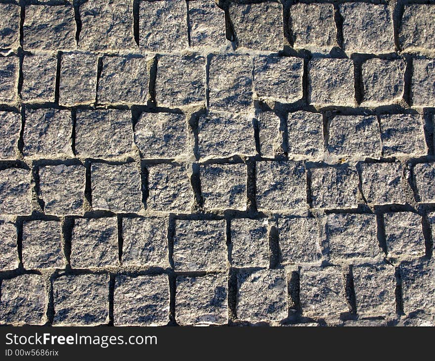 Rough grey granite pavement texture. Rough grey granite pavement texture