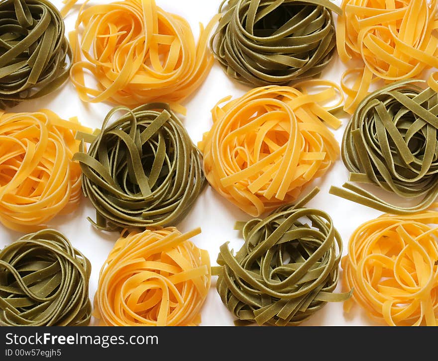 Colorful uncooked italian pasta tagliatelle. Colorful uncooked italian pasta tagliatelle