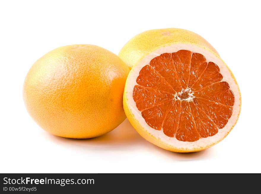 Fresh juicy grapefruit. Close up on a white background. Fresh juicy grapefruit. Close up on a white background.