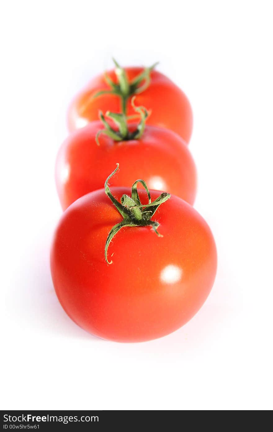 Fresh red tomatoes isolated on white background