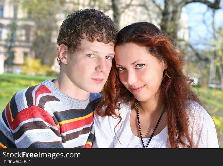 Young loving couple in the park