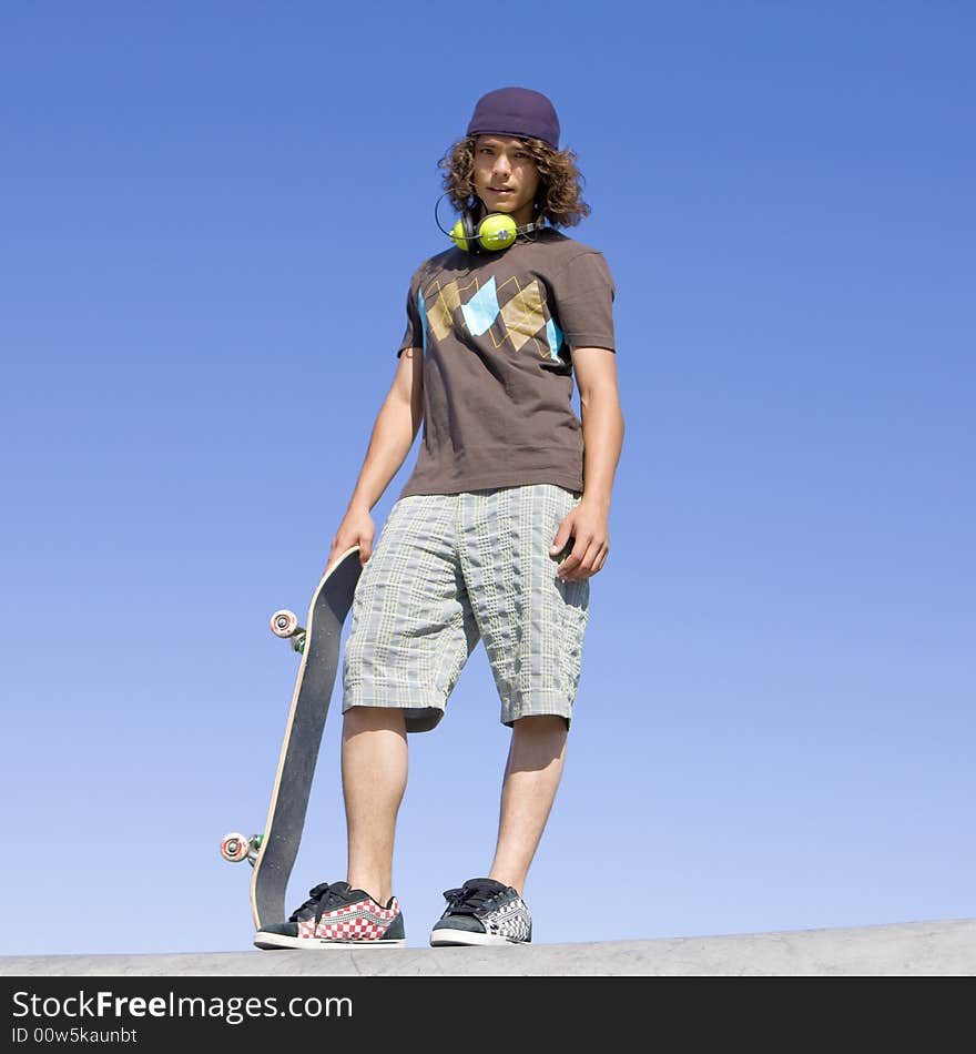 Teen Skater Atop Ramp