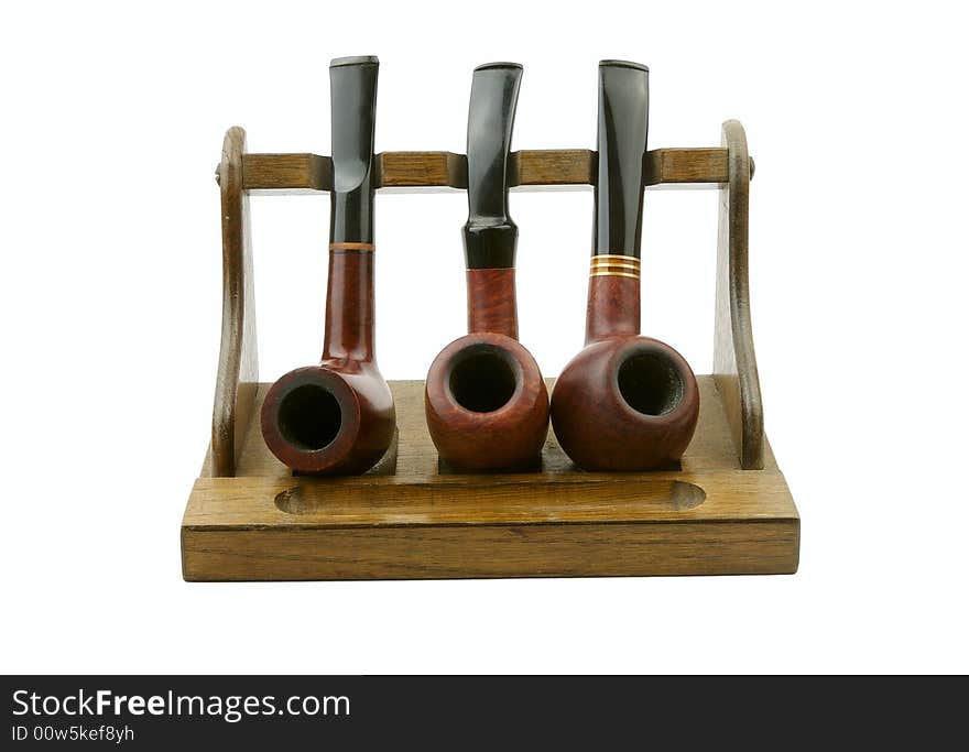 Tobacco-pipes with tobacco powder isolated over white background. Tobacco-pipes with tobacco powder isolated over white background