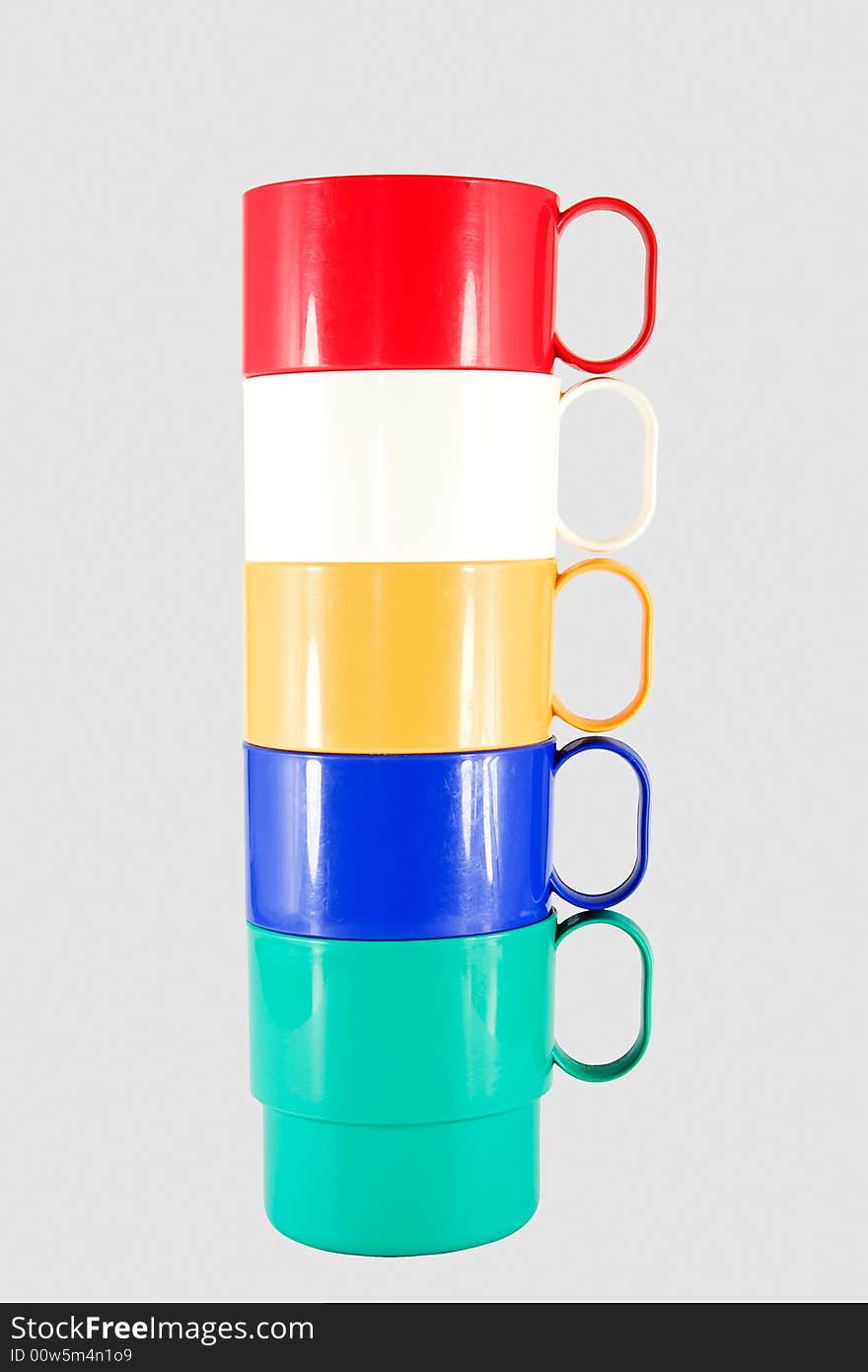 Stack of plastic mugs in various colors