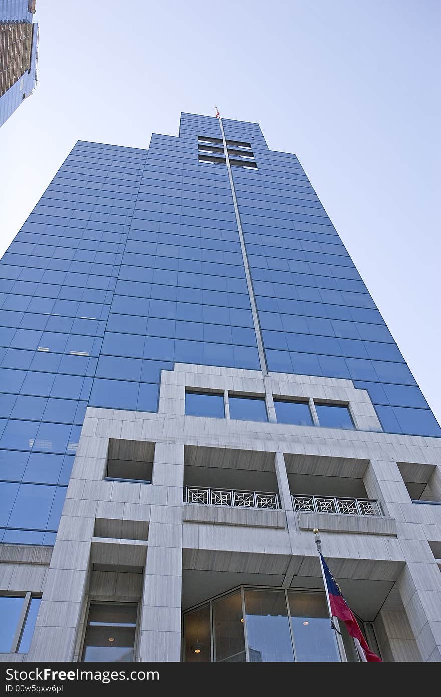 An office tower of blue glass and polished marble. An office tower of blue glass and polished marble