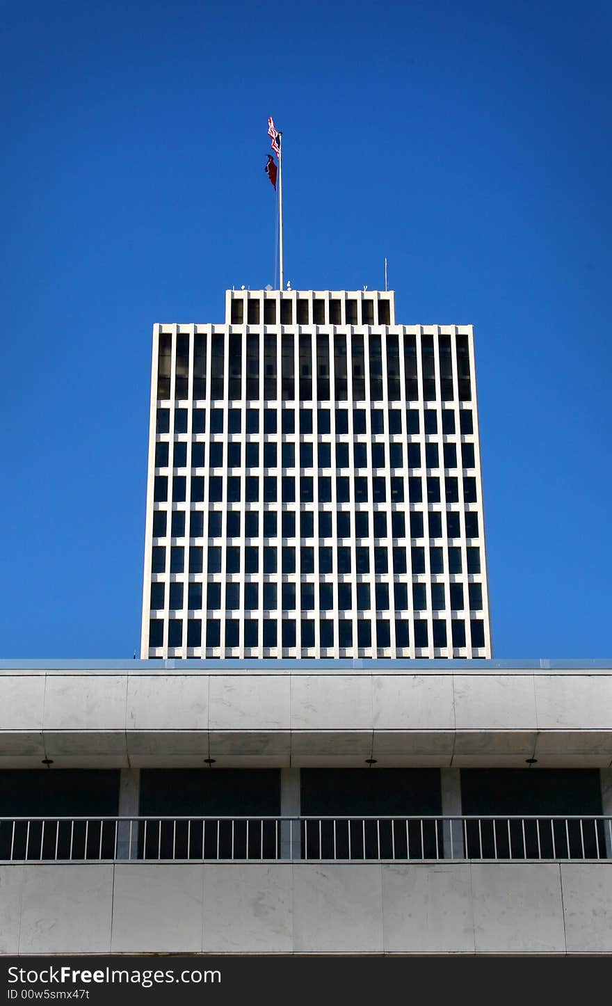 White modern skyscraper located in downtown. White modern skyscraper located in downtown