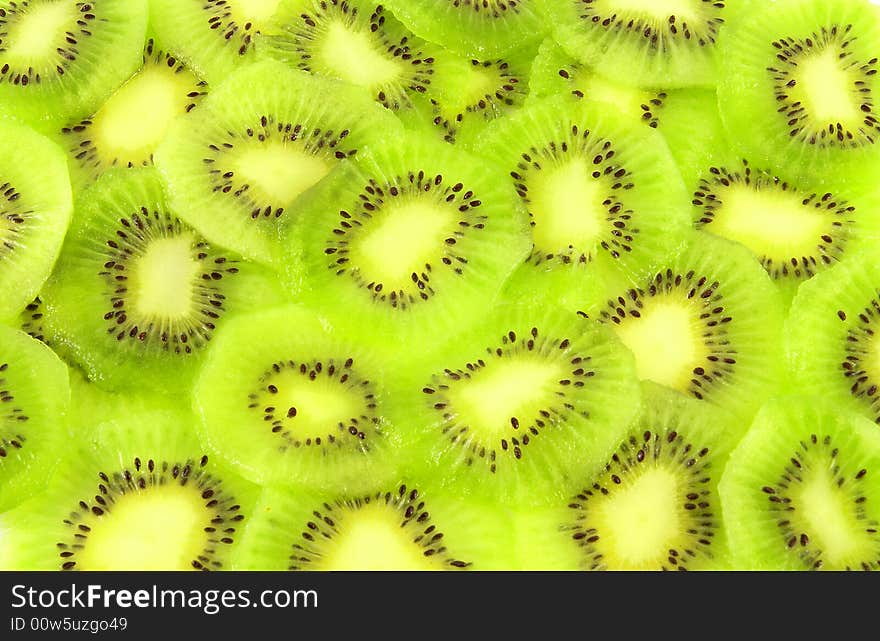 Background filled with kiwi fruit slices