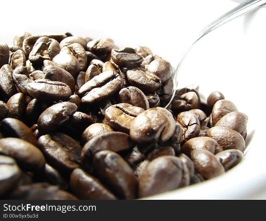 Natural coffee beans with spoon