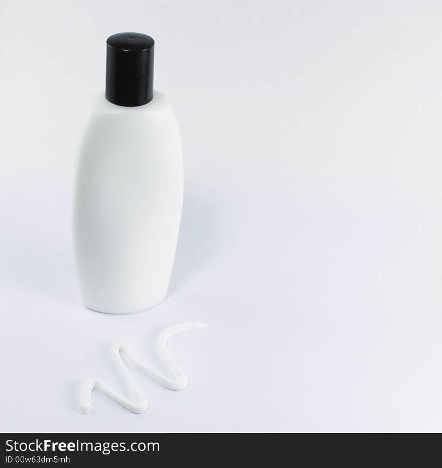 Cream and white bottle