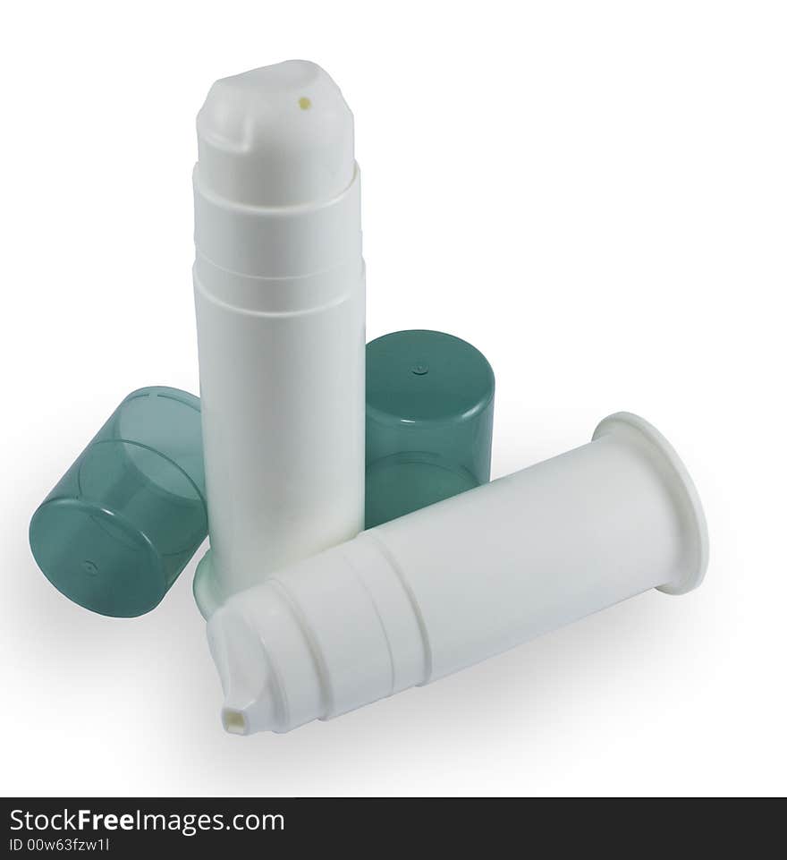 Tubes and caps on white background