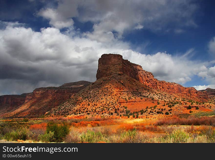 View of the red rock formations in Canyonlands National Park with blue sky�s and clouds. View of the red rock formations in Canyonlands National Park with blue sky�s and clouds