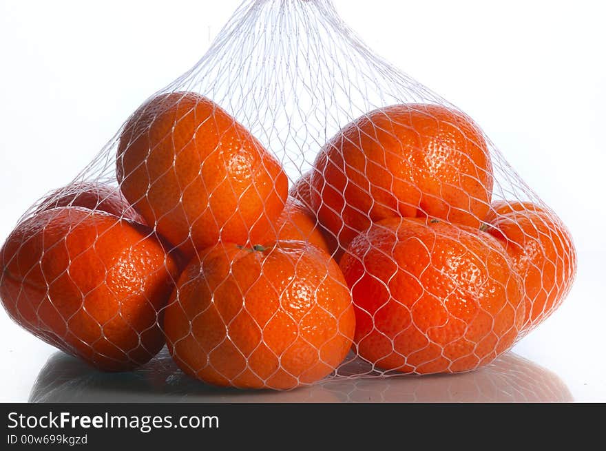 Closeup fruits of a tangerine on white. Closeup fruits of a tangerine on white.