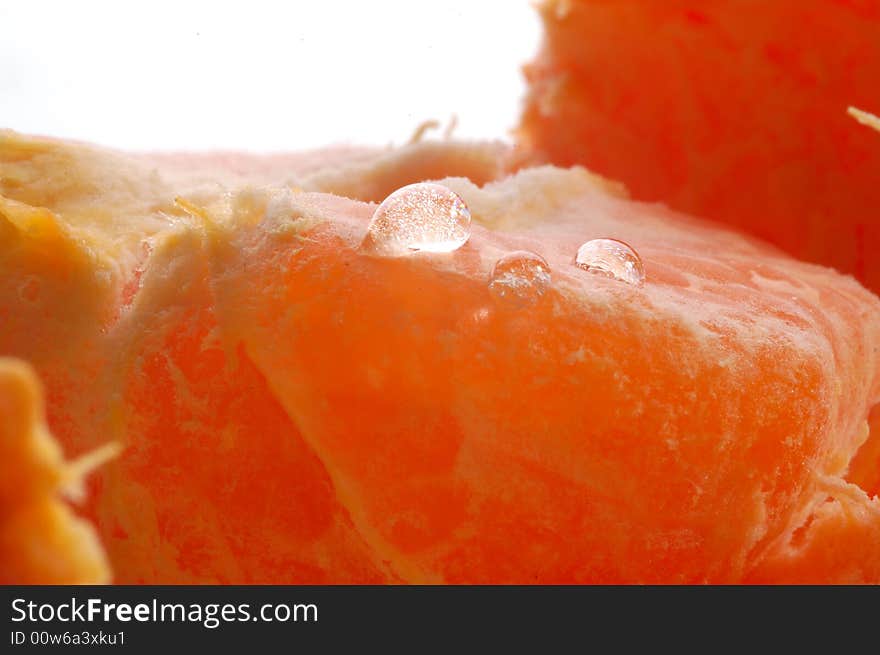 Closeup fruits of a tangerine on white. Closeup fruits of a tangerine on white.