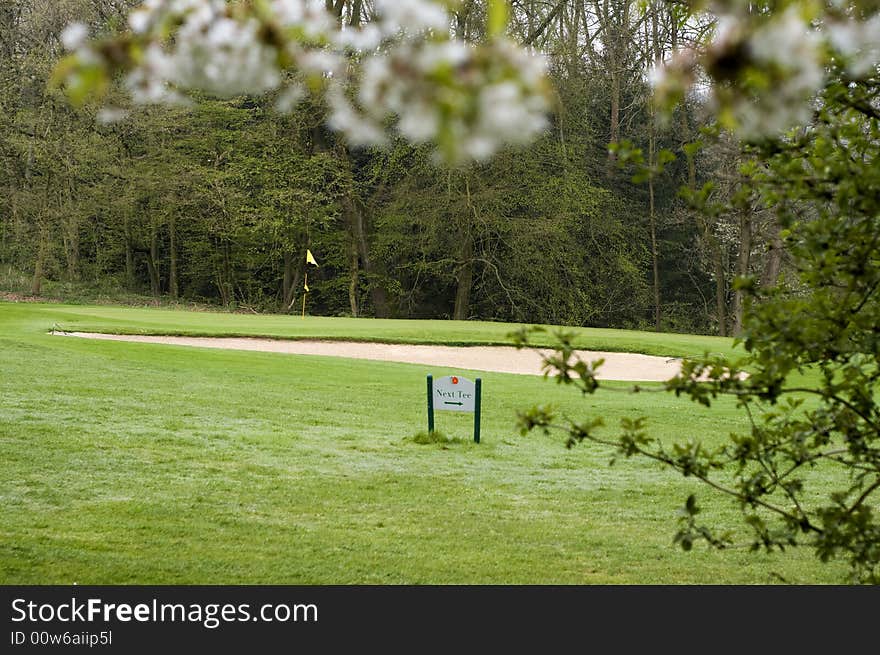 Very early on a golf course in spring. Very early on a golf course in spring