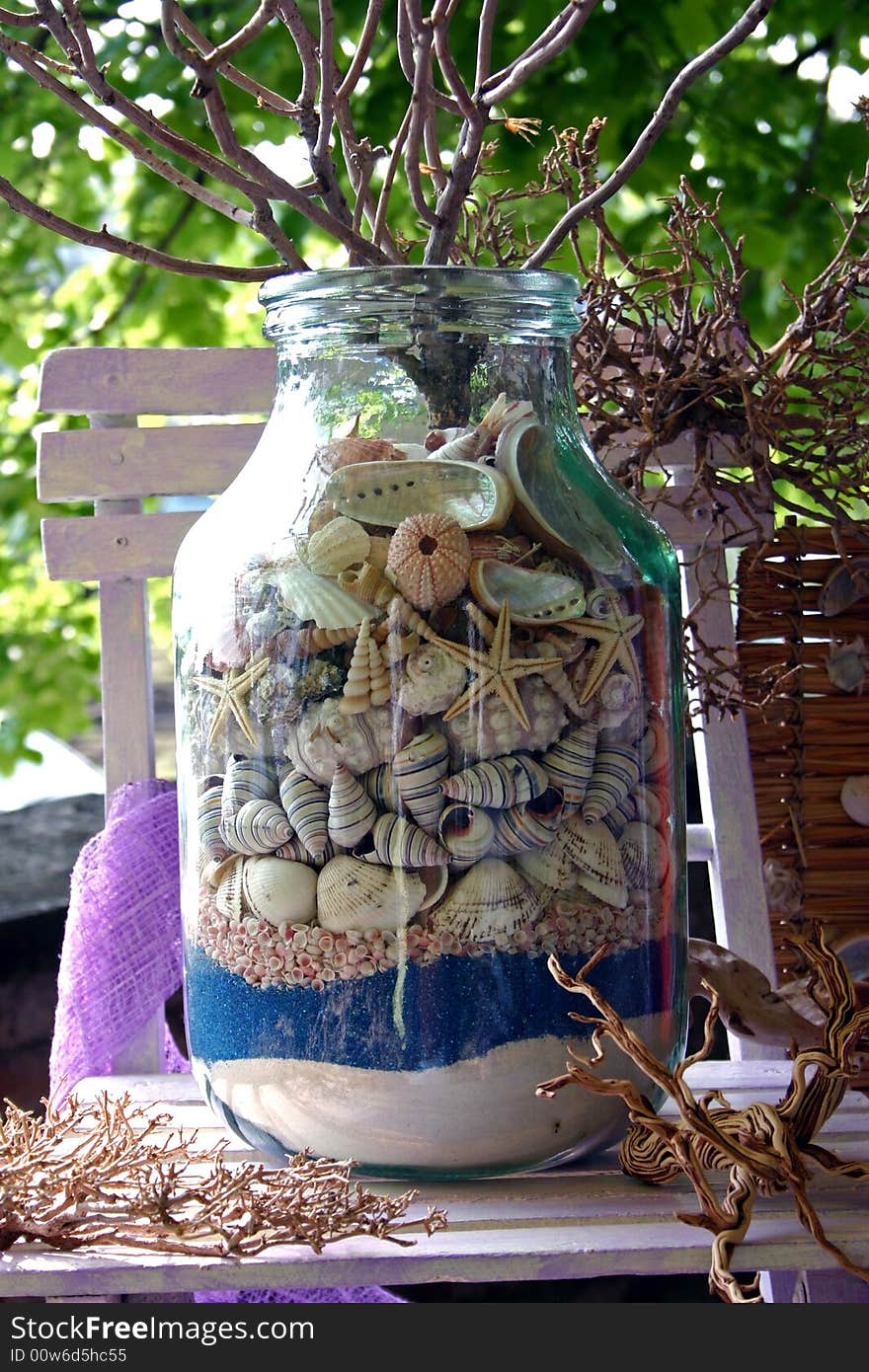 Glass jar with sea shells