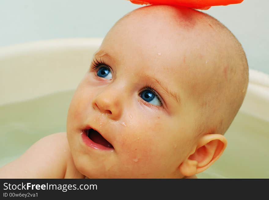 Portrait of smiling baby, close-up, isolated on white