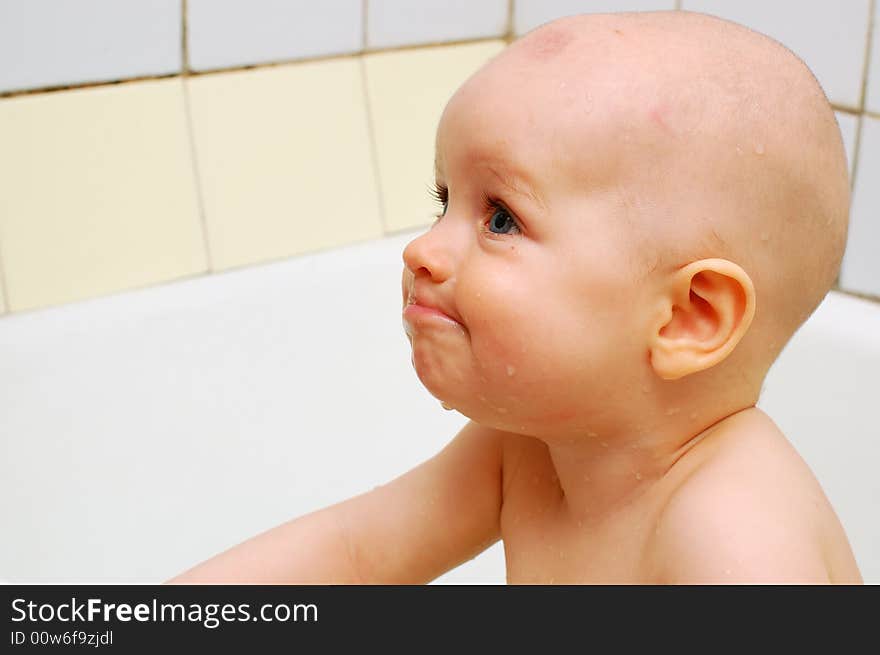 Portrait of smiling baby, close-up, isolated on white