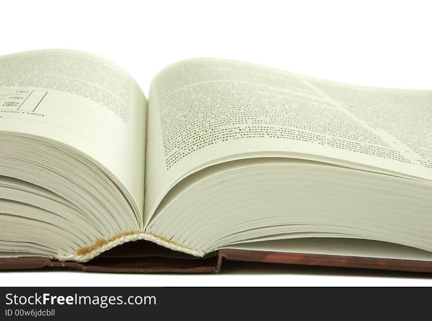 Isolated large open book on a white background, selective focus