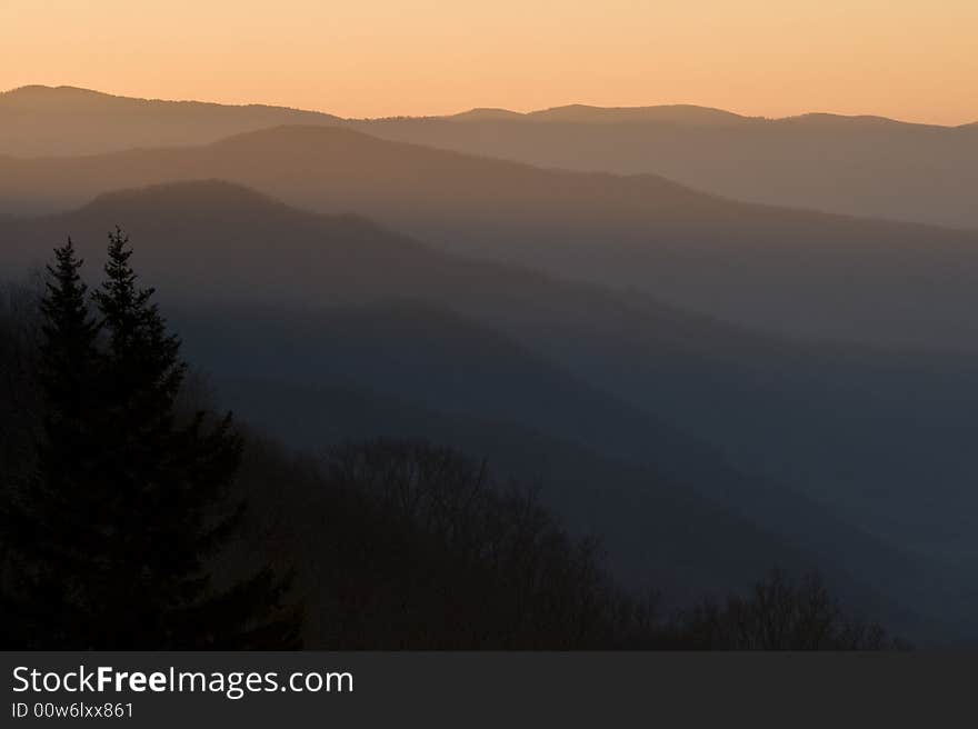 Smoky Mountain sunrise looking over the ridges of several mountain tops on a spring morning. Smoky Mountain sunrise looking over the ridges of several mountain tops on a spring morning.