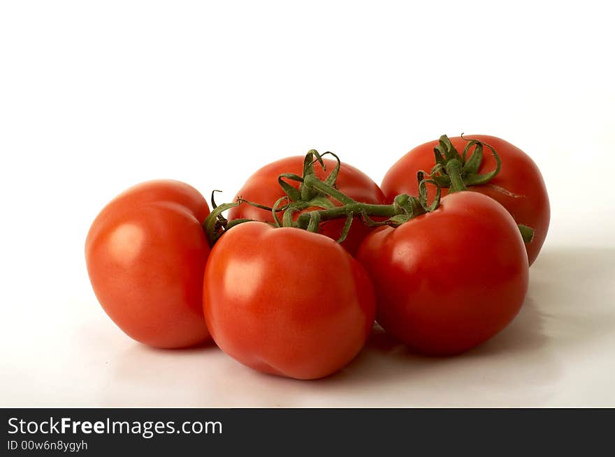 Group of tomatoes over white background