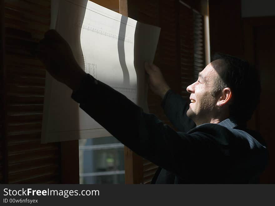 Man Reviewing Plans