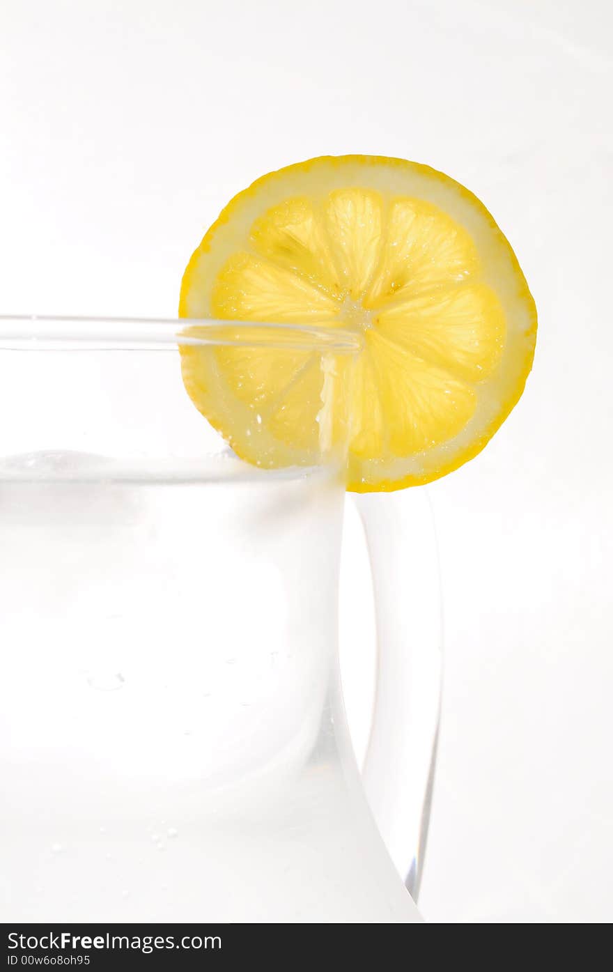 Refreshing summer drink with a slice of lemon