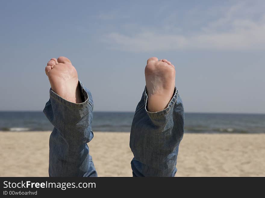 View of Bare Feet with a Backdrop of  Ocean. View of Bare Feet with a Backdrop of  Ocean