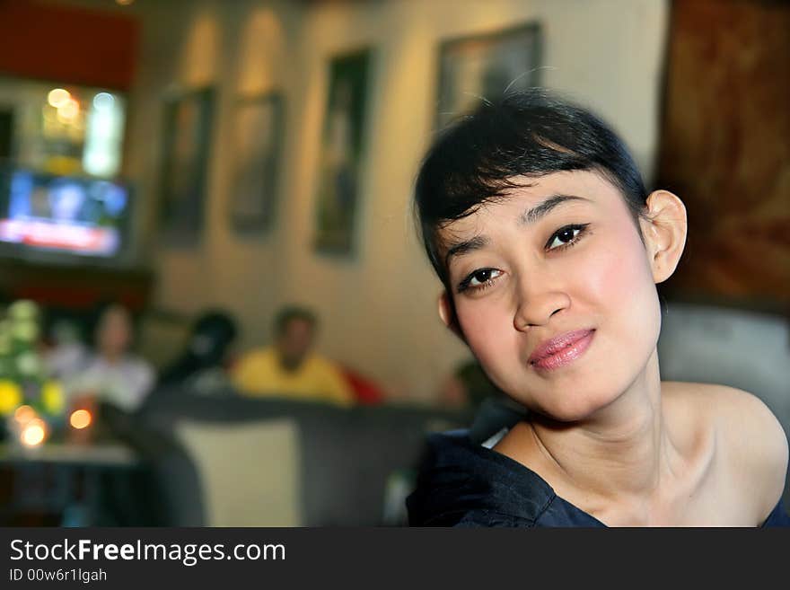 Photograph of asian girl at bar