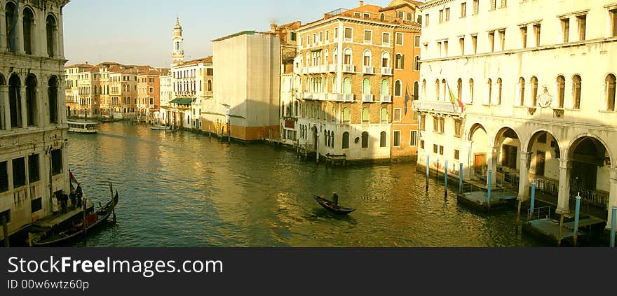 Venice (Italy) postcard: view from the Rialto Bridge of the Canal Grande with palaces in sunset light and gondolier crossing the canal

*suitable as postcard,greeting or poster. Venice (Italy) postcard: view from the Rialto Bridge of the Canal Grande with palaces in sunset light and gondolier crossing the canal

*suitable as postcard,greeting or poster