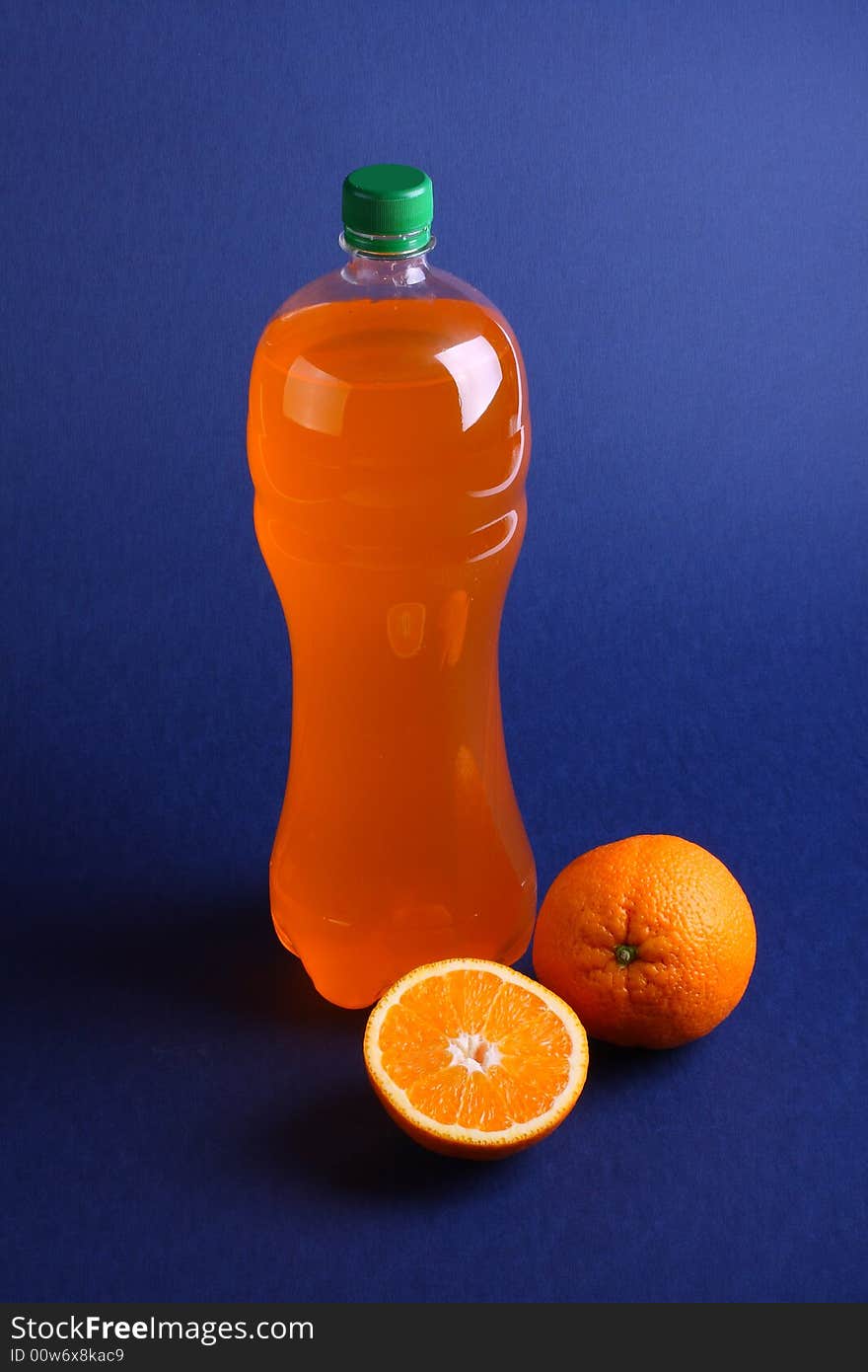 Oranges and bottle with juice. Oranges and bottle with juice