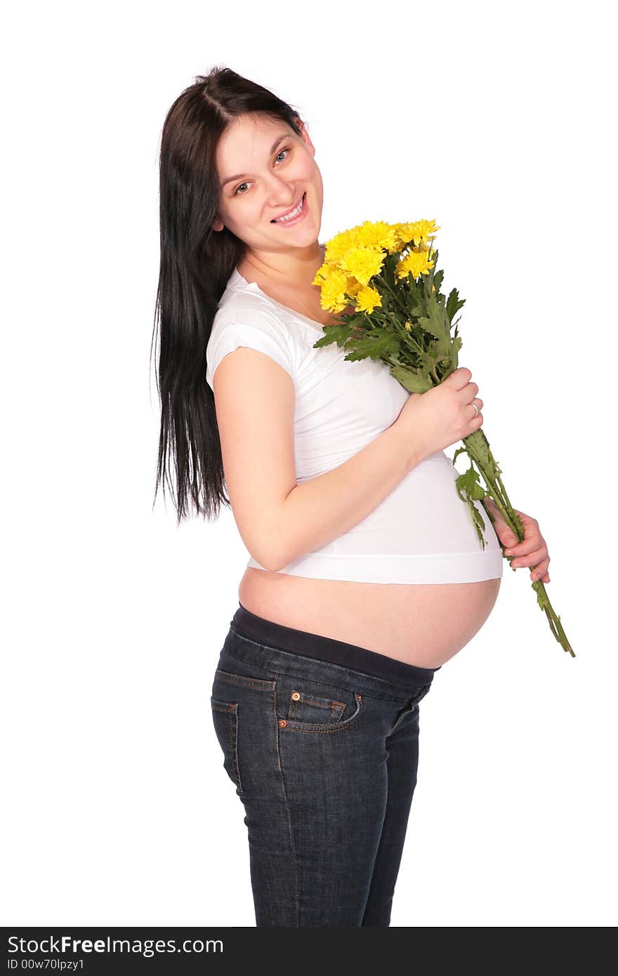 Pregnant girl with flowers on a white