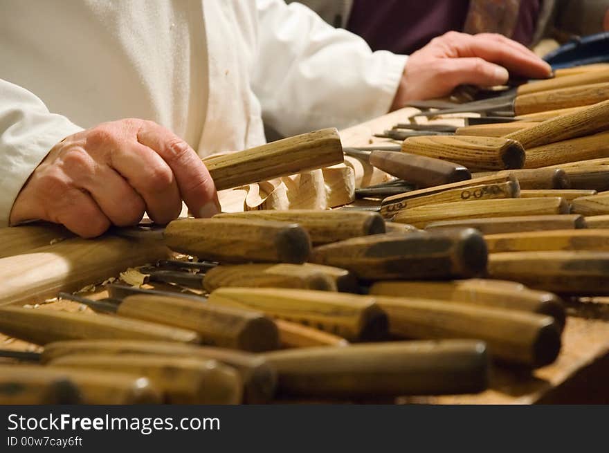 Hands of a cabinetmaker with tools. Hands of a cabinetmaker with tools