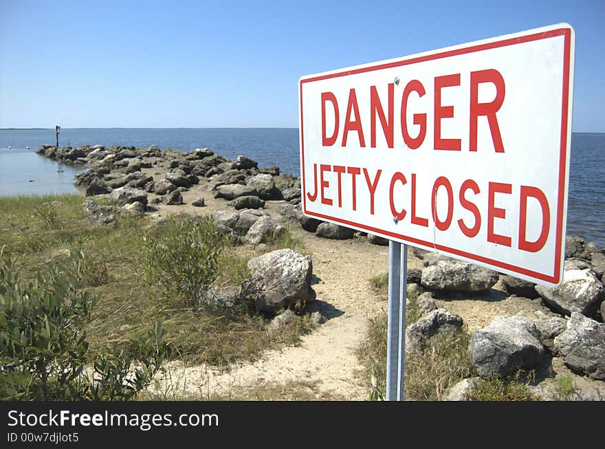 Closed jetty sign at a florida beach