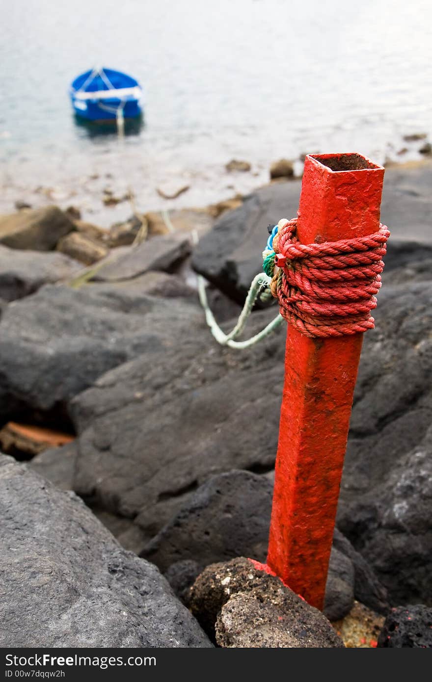 Boat tied to shore