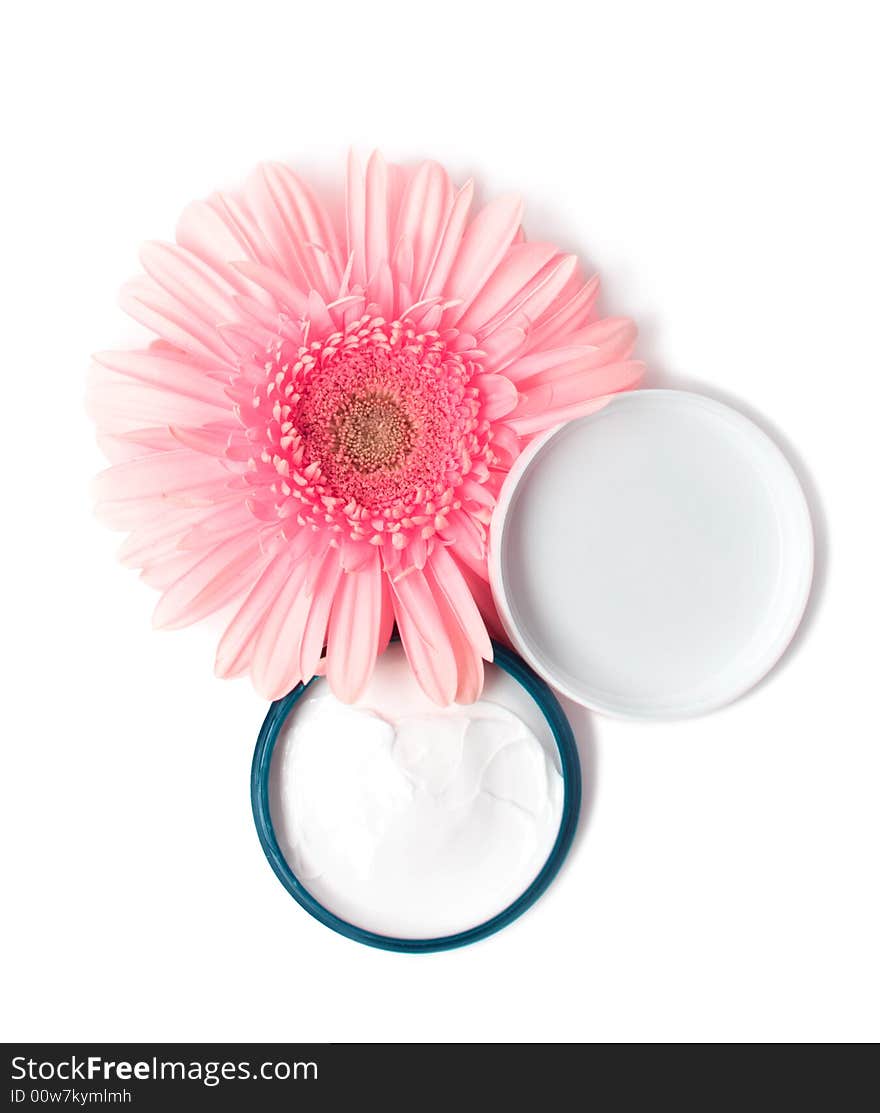 Moisturizing cream with pink gerbera close up