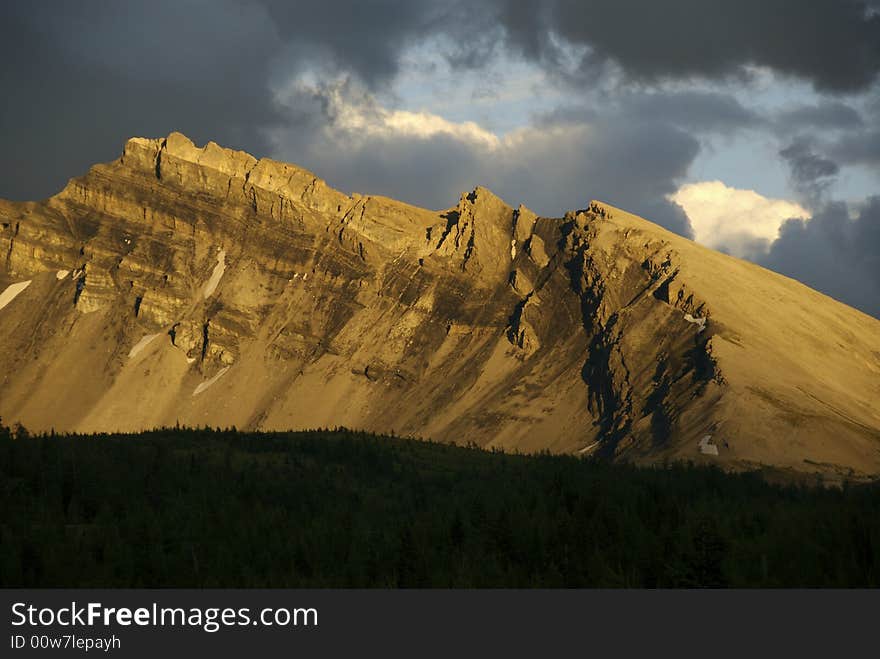 Evening light illuminates a remote mountain ridge. Evening light illuminates a remote mountain ridge